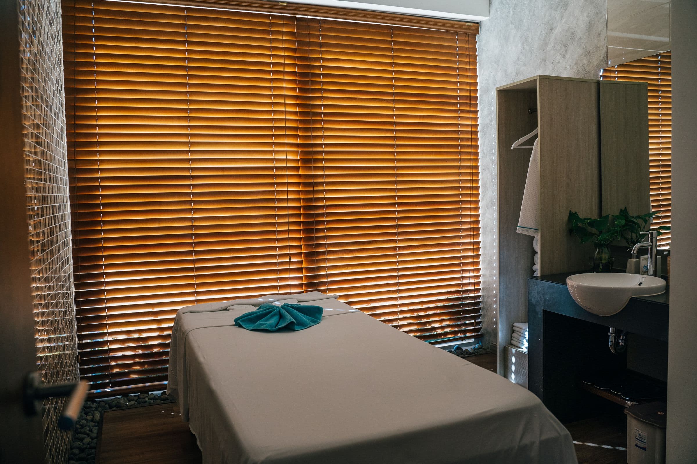 Massage table set up and ready in a bright, naturally lit room